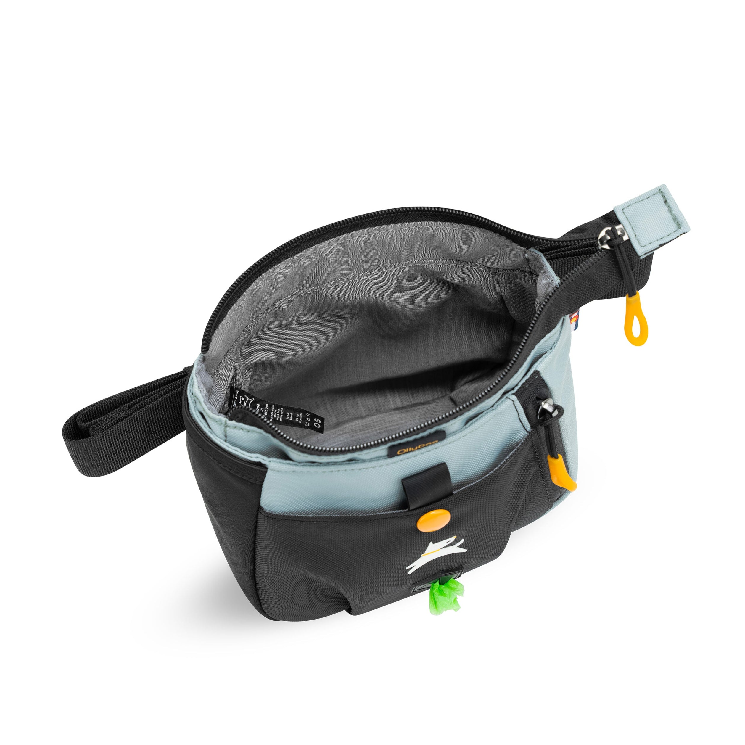 Opened view of OllyDog’s Backcountry Day Bag in St. Lucia, a dog training tool designed for quick access to treats, ideal for rewarding good behavior. With a spacious compartment for storage, this practical dog hiking gear is perfect for convenient training while exploring dog friendly trails. #color_st. lucia