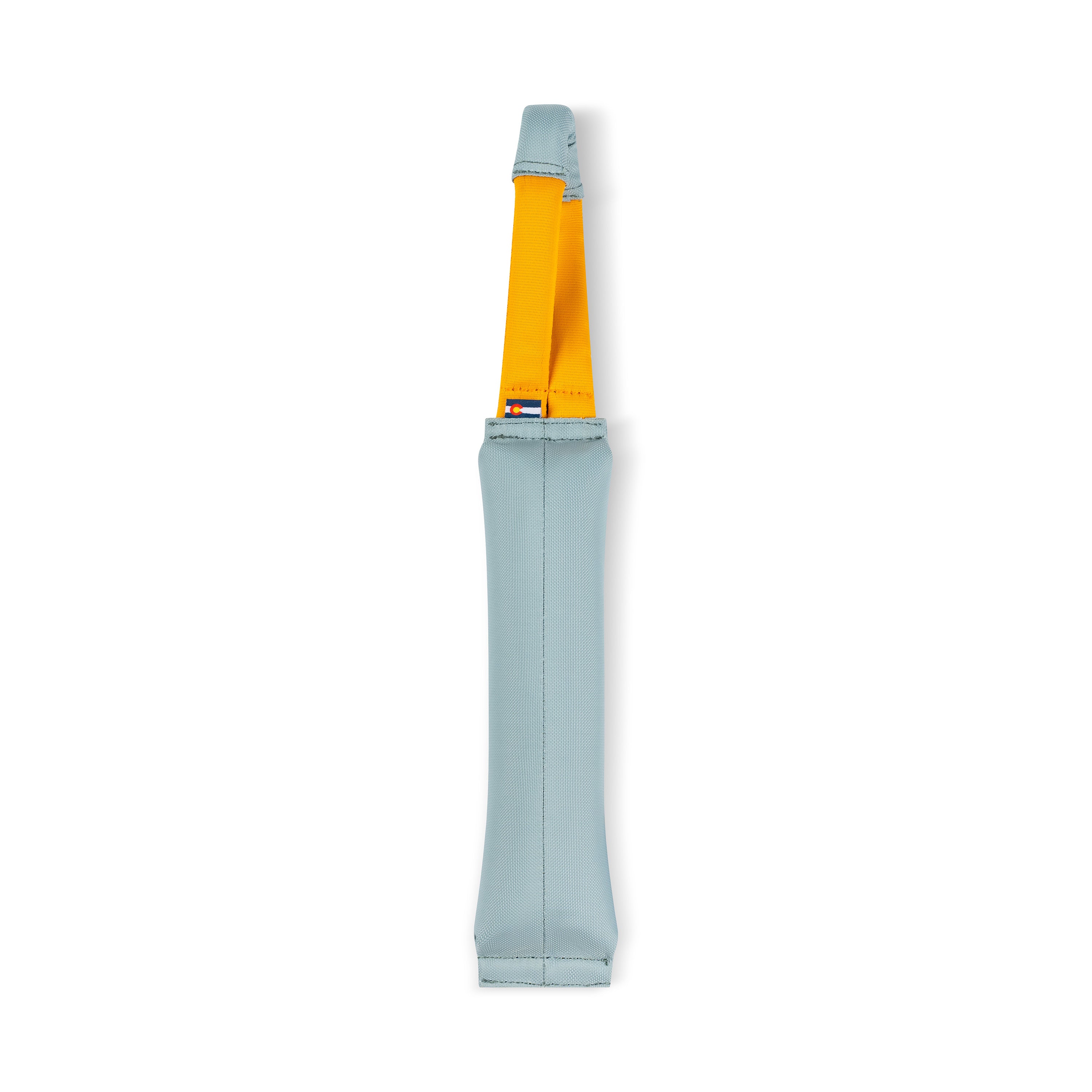 Back view of the OllyDog Tugger dog toy in St. Lucia color, showing the recycled fabric body and sturdy yellow handle, designed for tugging, fetching, and interactive dog play #color_st. lucia