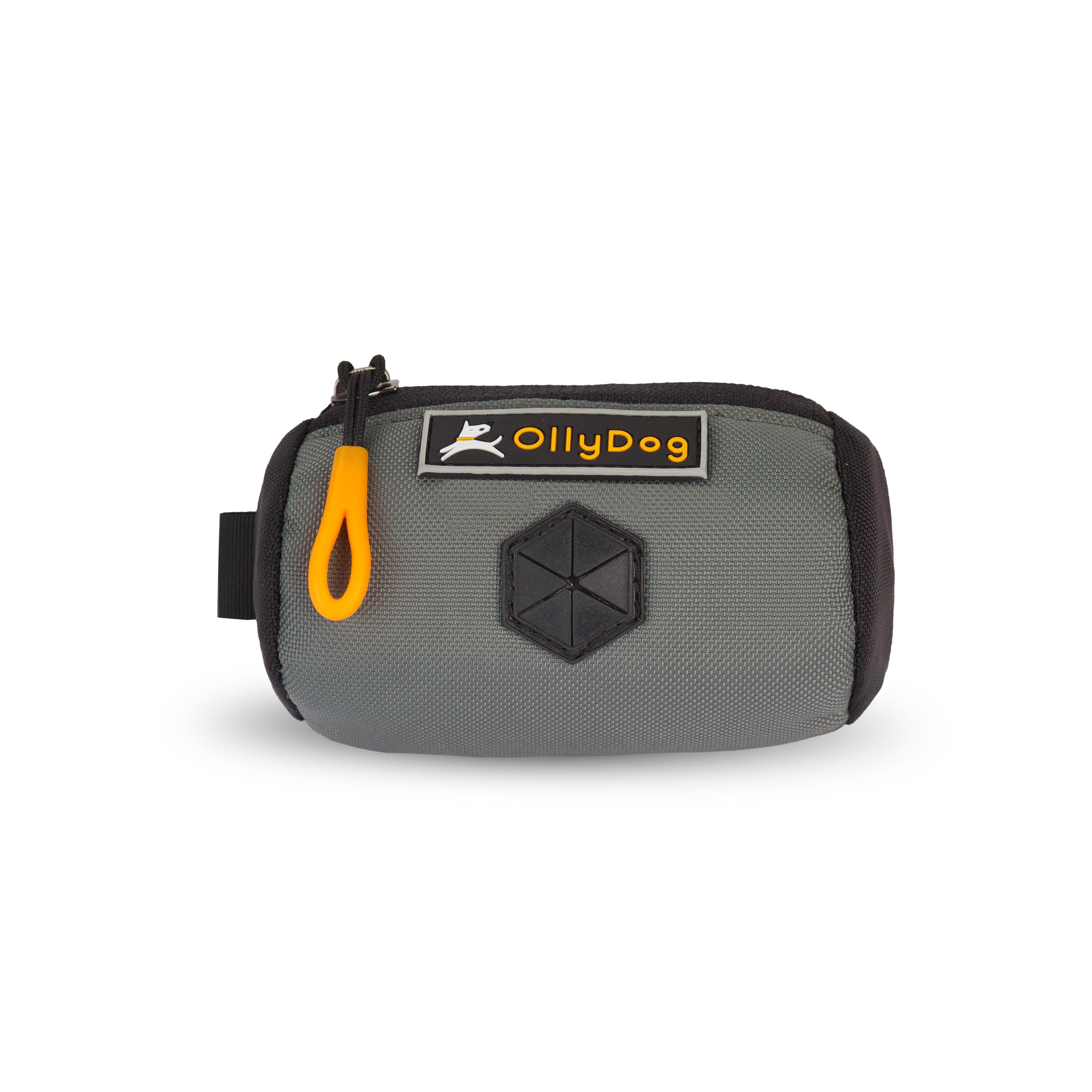 Flat front view of OllyDog’s Scoop Pick Up Bag in Juniper. This doggie poop bag holder features a zipper closure, a snap button for quick attachment to a belt loop, and a rubber dispensing cover, making it an ideal doggie bag holder for leash. #color_juniper