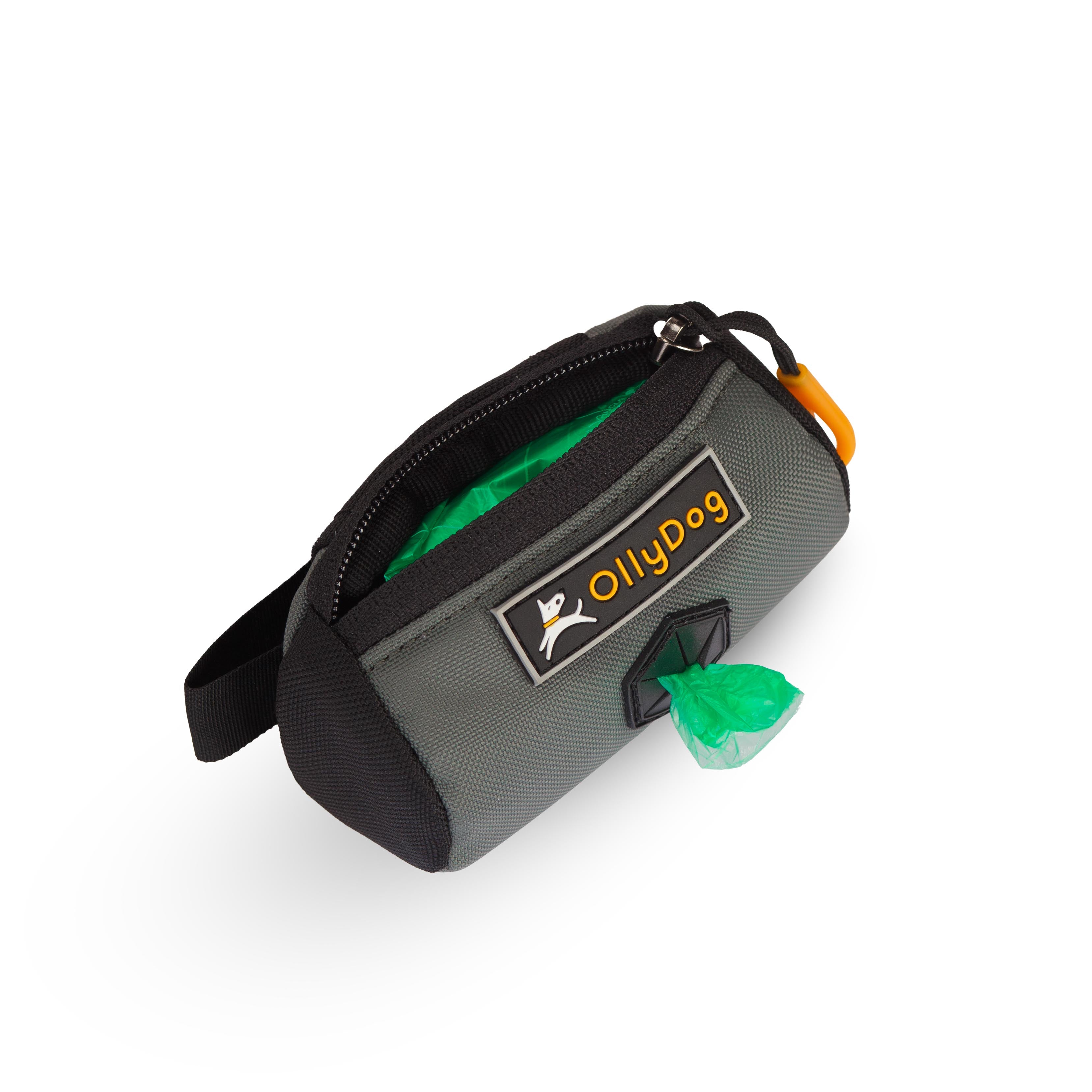 Opened view of the Scoop Pick Up Bag in Juniper. This doggy waste bag holder serves as a convenient poop bag dispenser, allowing quick access to dog poop bags on the go. The small compartment can hold standard bag rolls, keys, or a lipstick, making it a versatile doggie bag holder for leash. #color_juniper