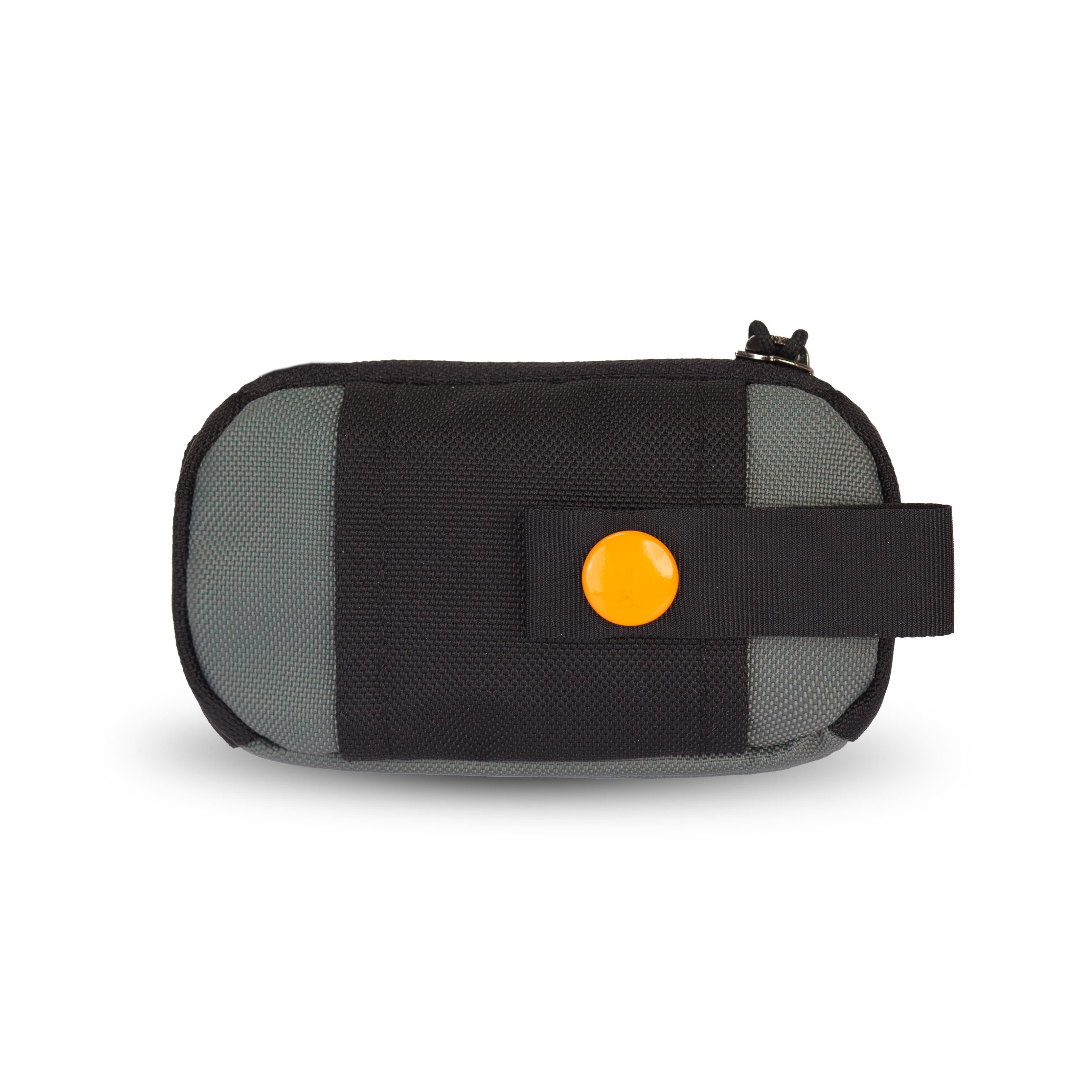 Back view of the Scoop Pick Up Bag in Juniper. This doggy waste bag holder features a snap button for easy attachment to a leash or any location, serving as a practical poop bag dispenser for dog owners. #color_juniper