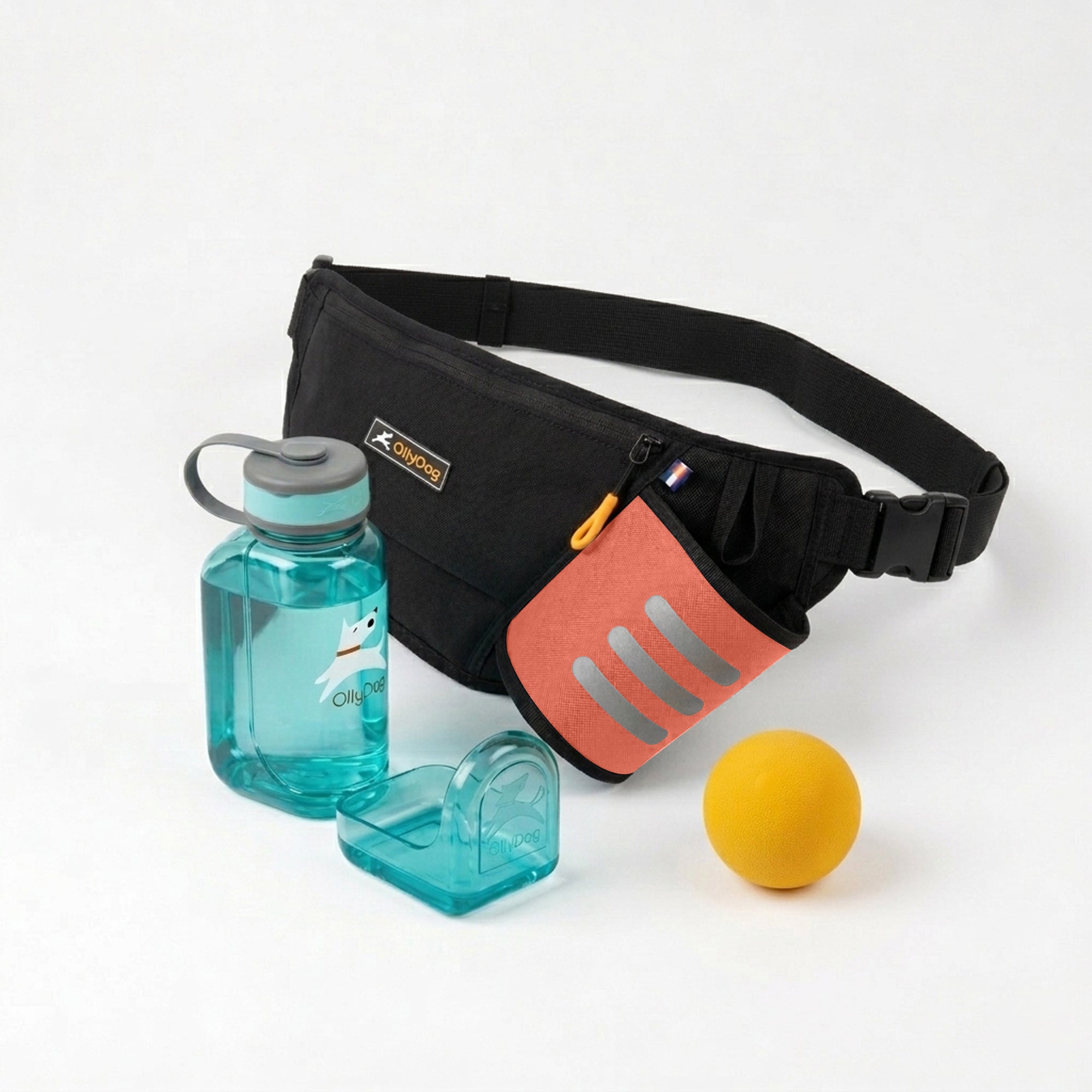 OllyDog dog walking bundle featuring a Raven black Hydro-Slim fanny pack with a Flame red accent pocket, a teal blue portable OllyBottle with an integrated drinking bowl, and a yellow rubber Happy Camper ball