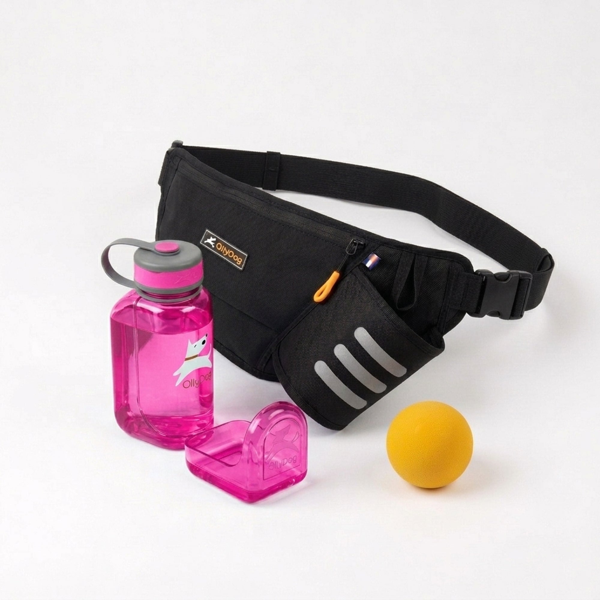 OllyDog dog training and walking bundle featuring a Raven black Hydro-Slim fanny pack, a bright pink portable OllyBottle dog water bottle with an integrated drinking bowl, and a yellow rubber Happy Camper ball
