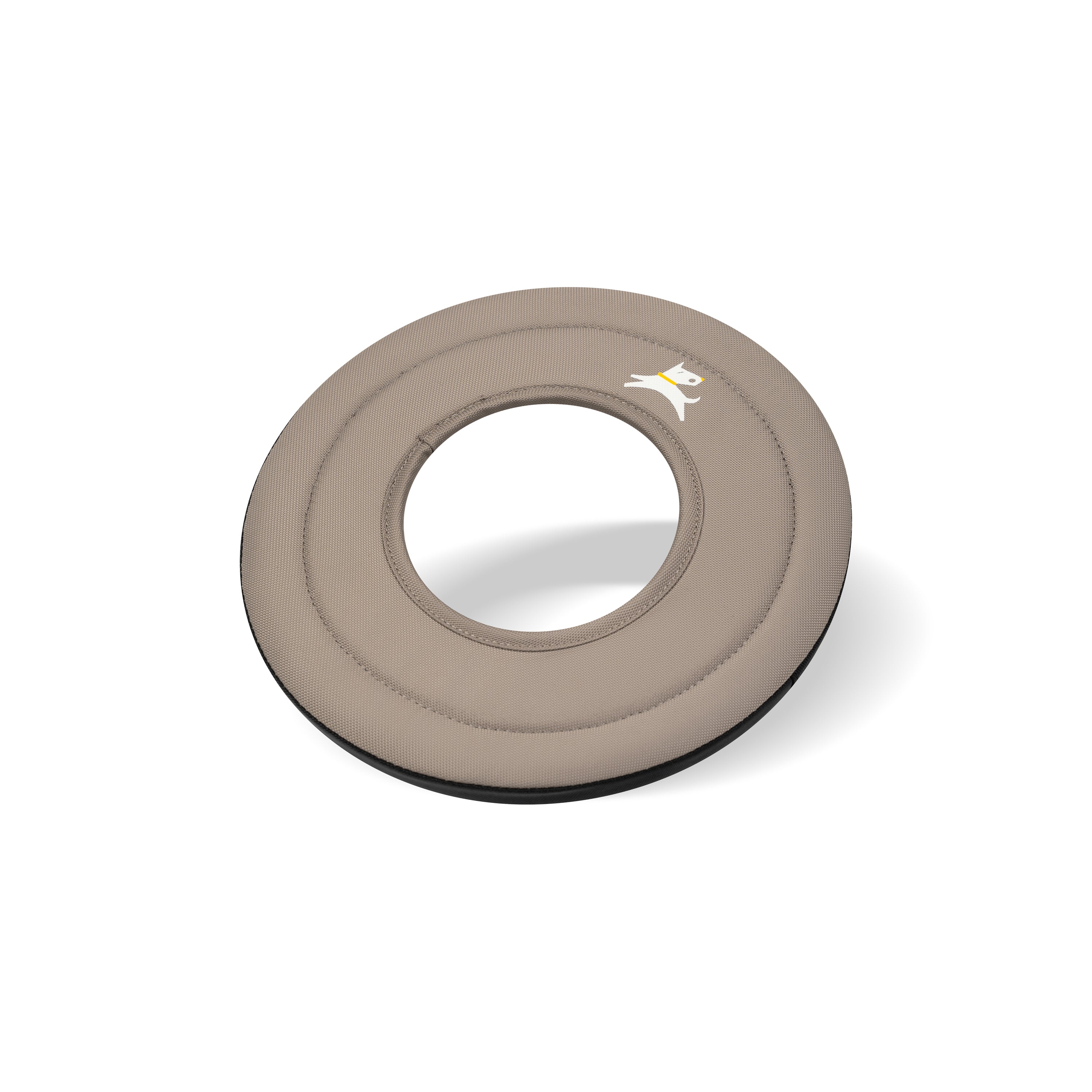 Side-angle view of the OllyDog Mini Super Flyer dog flying disc in dune tan color, highlighting its lightweight, easy-to-grab, and water-compatible recycled polyester design. #color_dune