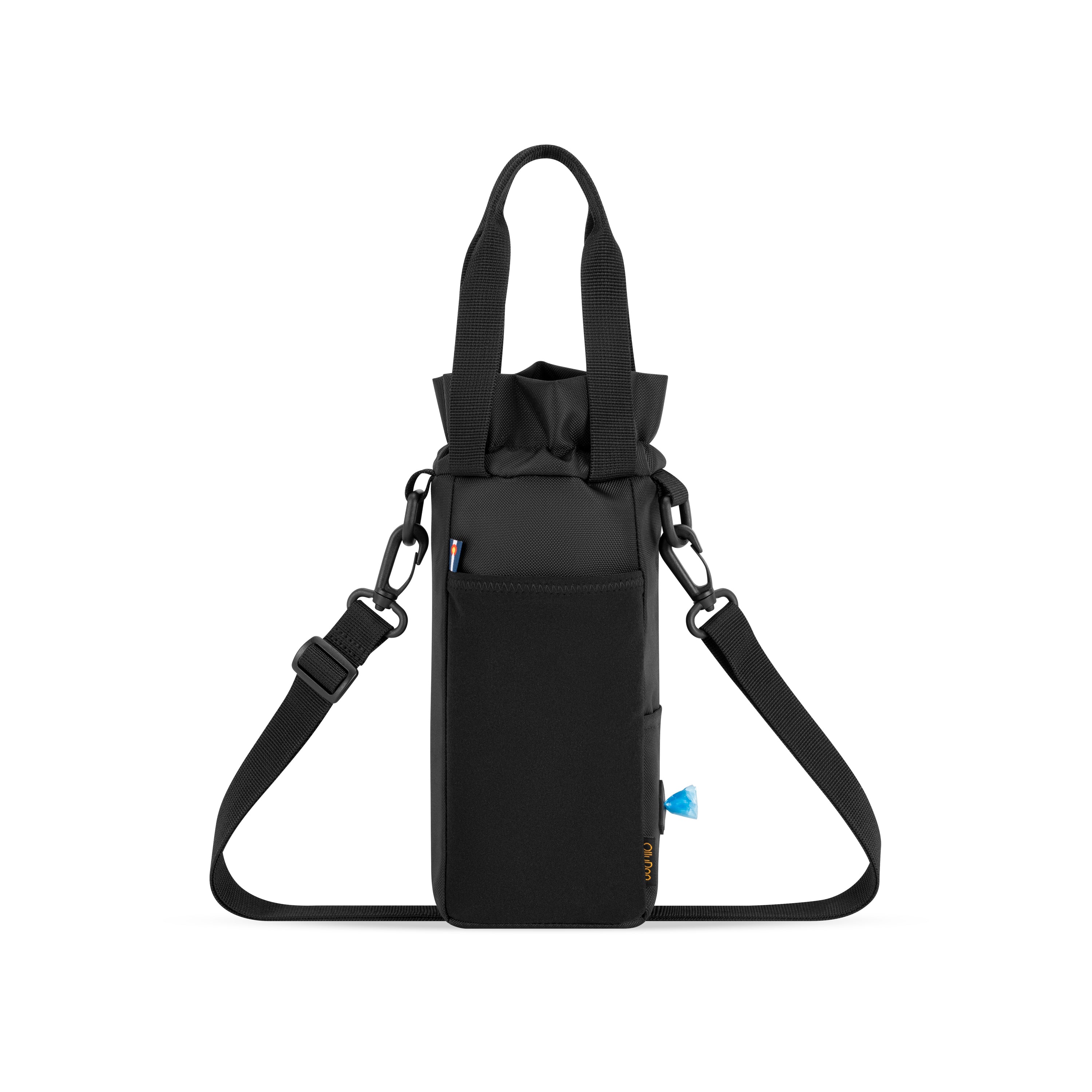 Back view of the OllyDog OllyCaddy dog walking carryall in raven color, highlighting the convenient back stretch pocket, built-in waste bag dispenser, grip handles, and adjustable crossbody strap. #color_raven