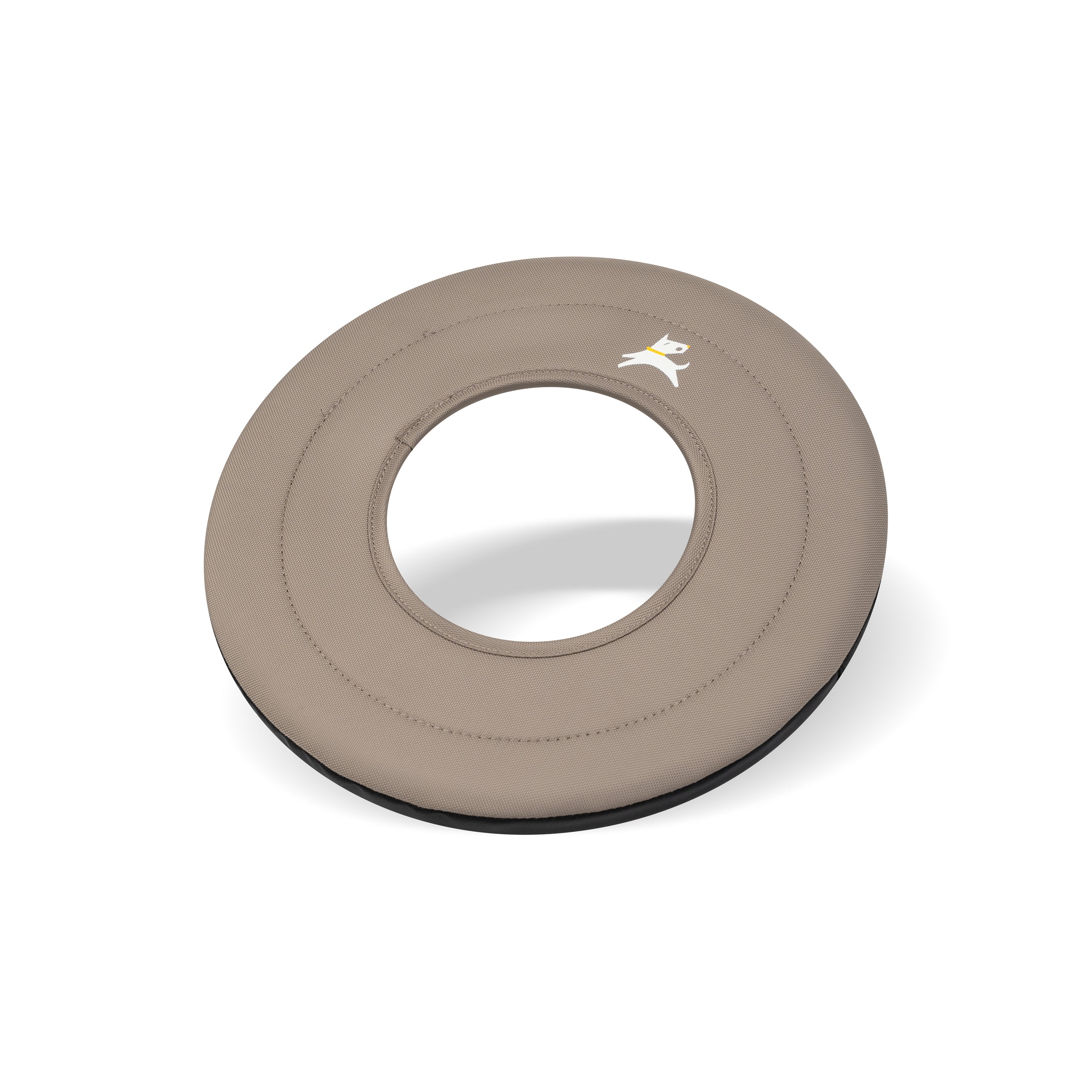 Side-angle view of the OllyDog Super Flyer dog flying disc in dune tan color, highlighting its lightweight, easy-to-grab, and water-compatible recycled polyester design. #color_dune