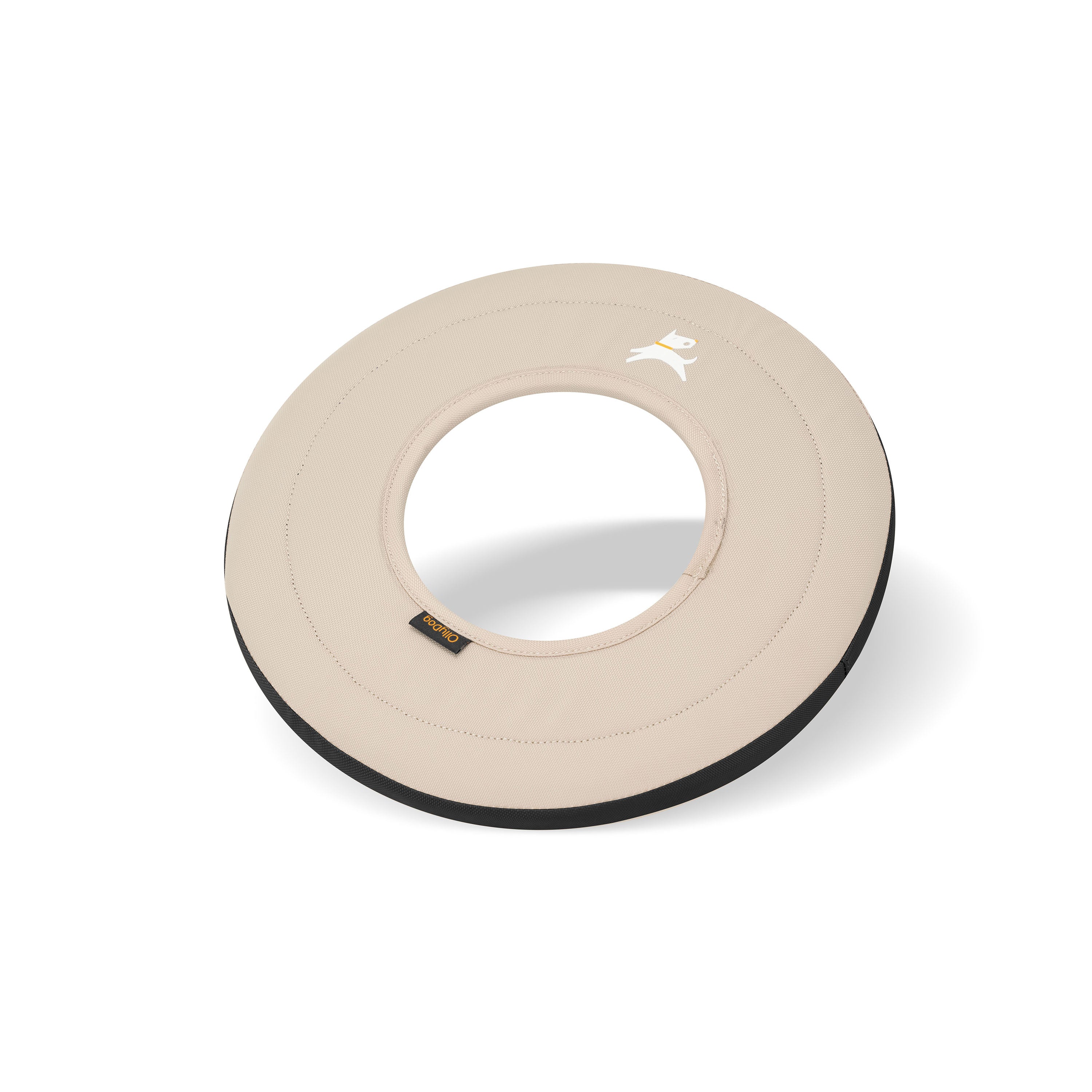 Side view of the Super Flyer fabric dog frisbee in Con Leche color, showing beige surface with black trim and center cutout #color_con leche