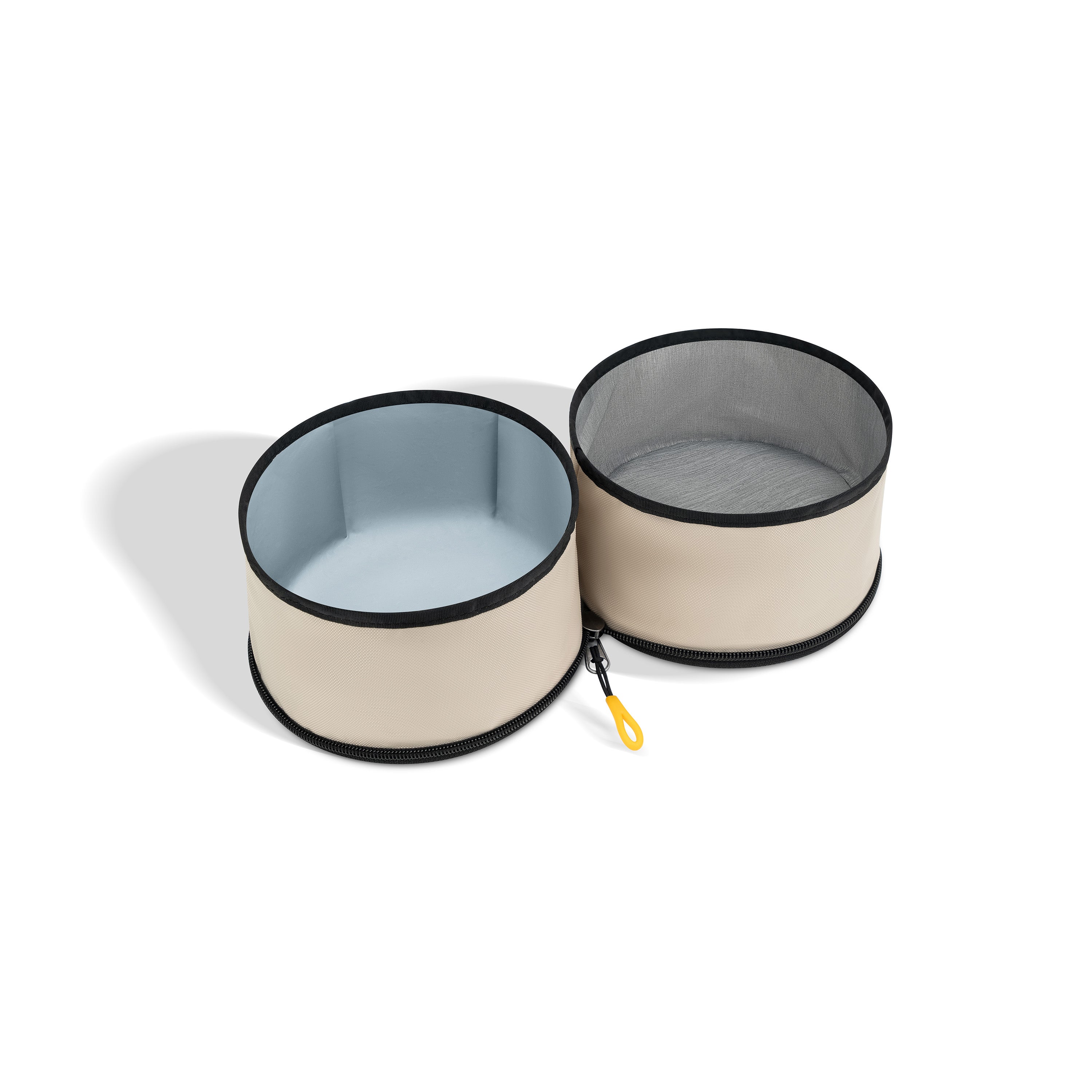 OllyDog Superbowl collapsible dog bowl in color Con Leche, featuring two compartments—one for water and one for food—with mesh cover and yellow clip, shown fully expanded on white background. #color_con leche