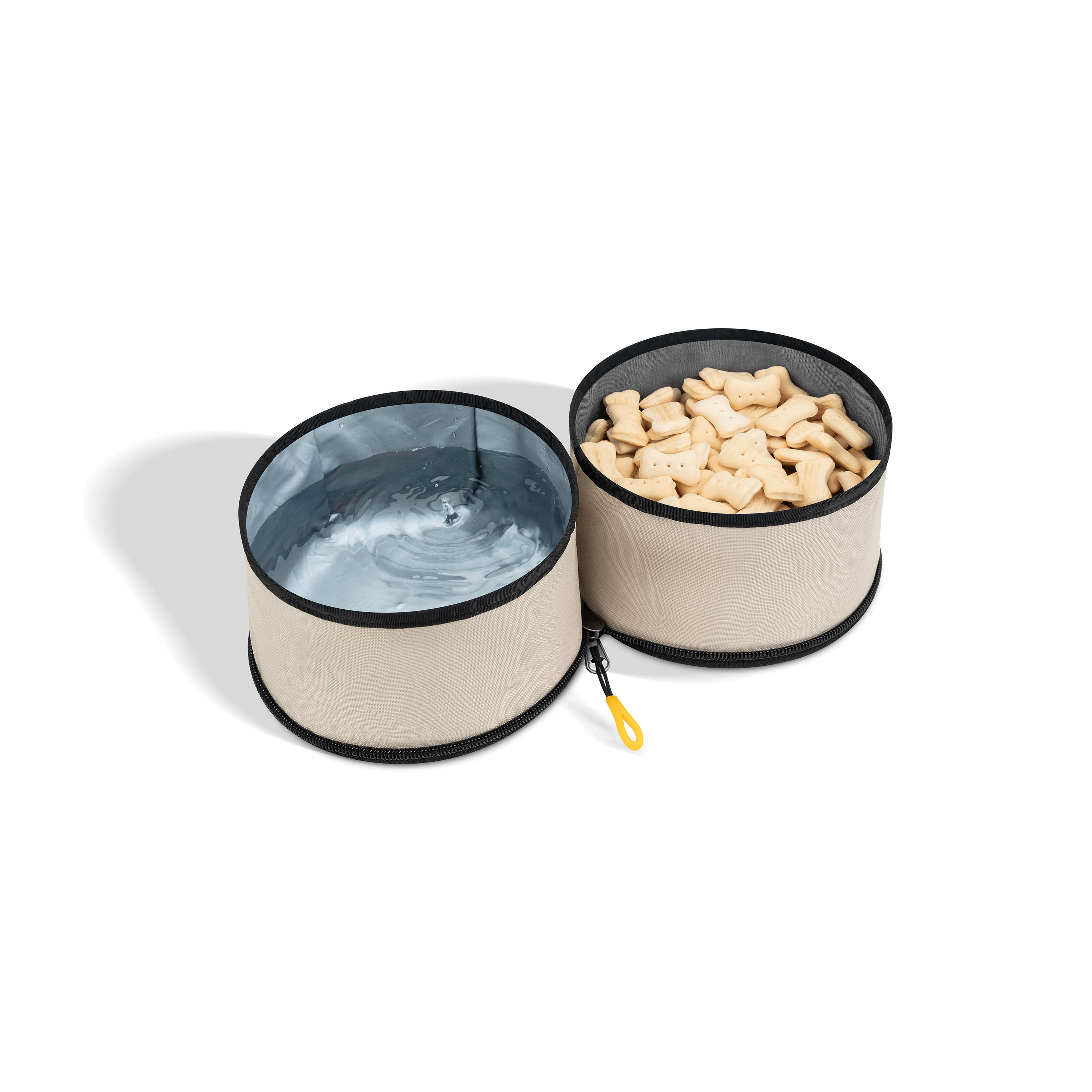 OllyDog Superbowl in color Con Leche shown open with two compartments—one filled with water, the other with bone-shaped dog treats #color_con leche