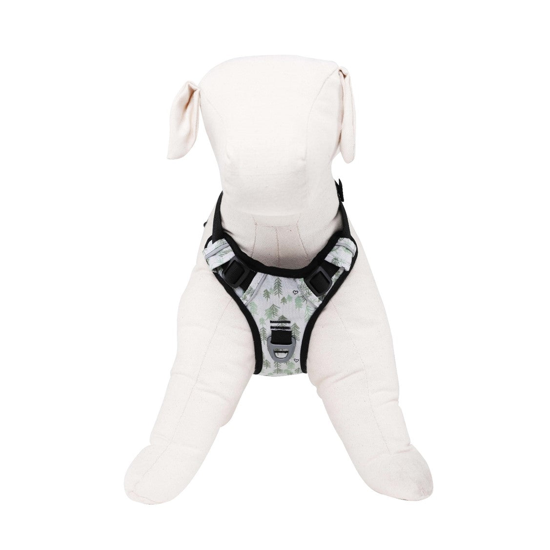 Front view of a dog mannequin displaying the OllyDog Alpine Reflective Harness in tree hugger print, highlighting chest attachment point, adjustable plastic buckle points, and breathable comfort design made from recycled plastic bottles. #color_tree hugger print