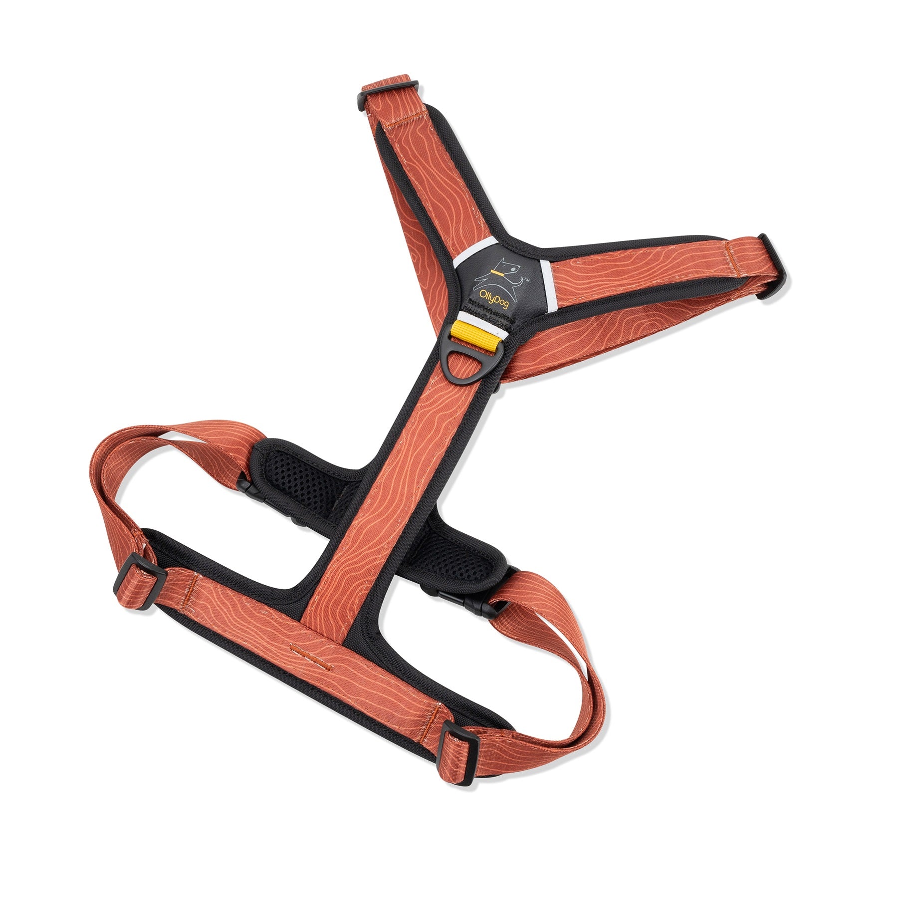 Flat lay of OllyDog Alpine Reflective Comfort Harness in Clay color with woodgrain pattern, featuring padded neoprene lining, two aluminum D-rings, and durable adjustable straps #color_clay woodgrain