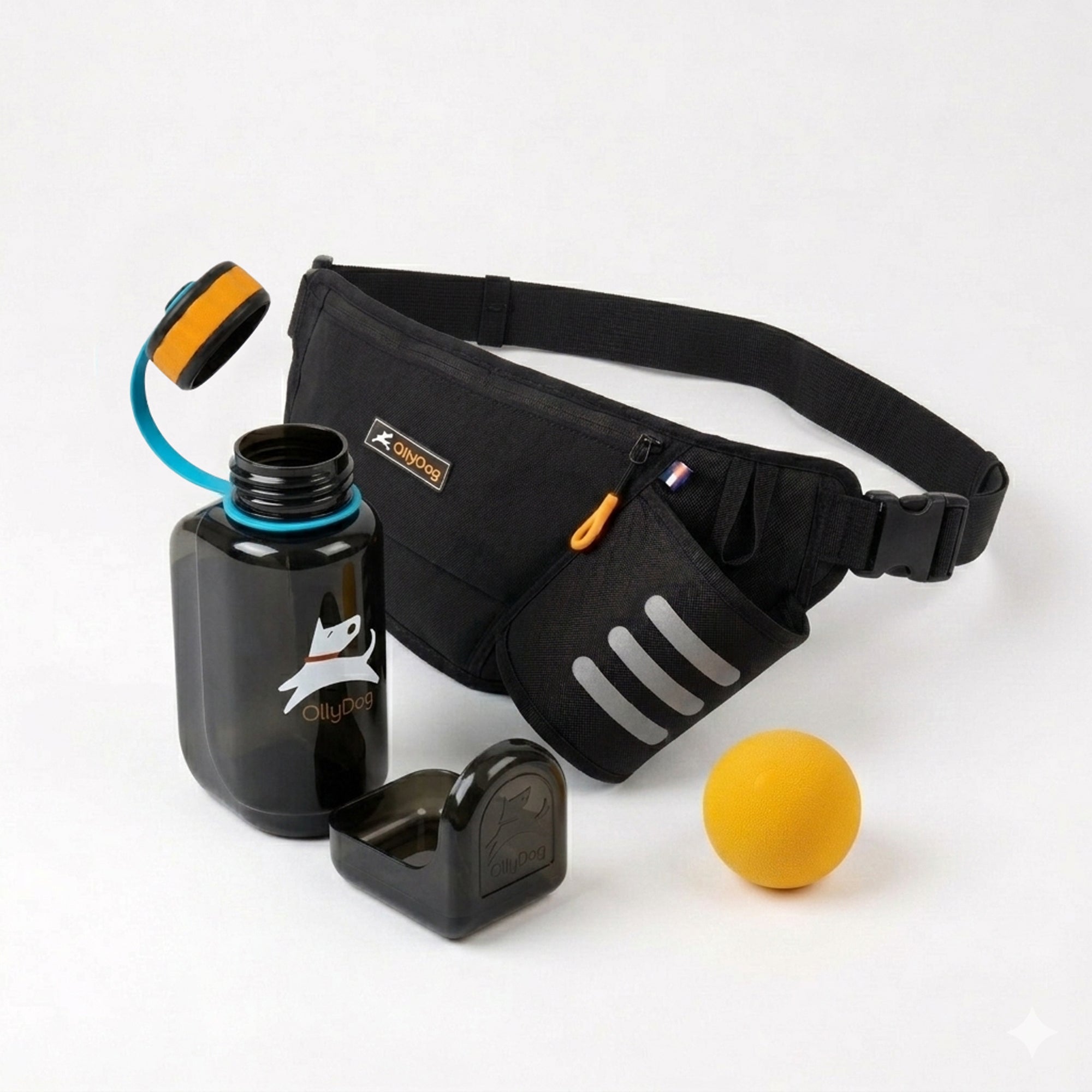 OllyDog dog walking bundle featuring a Raven black Hydro-Slim fanny pack, a black portable OllyBottle dog water bottle with teal accents and an integrated bowl, and a yellow rubber Happy Camper bal
