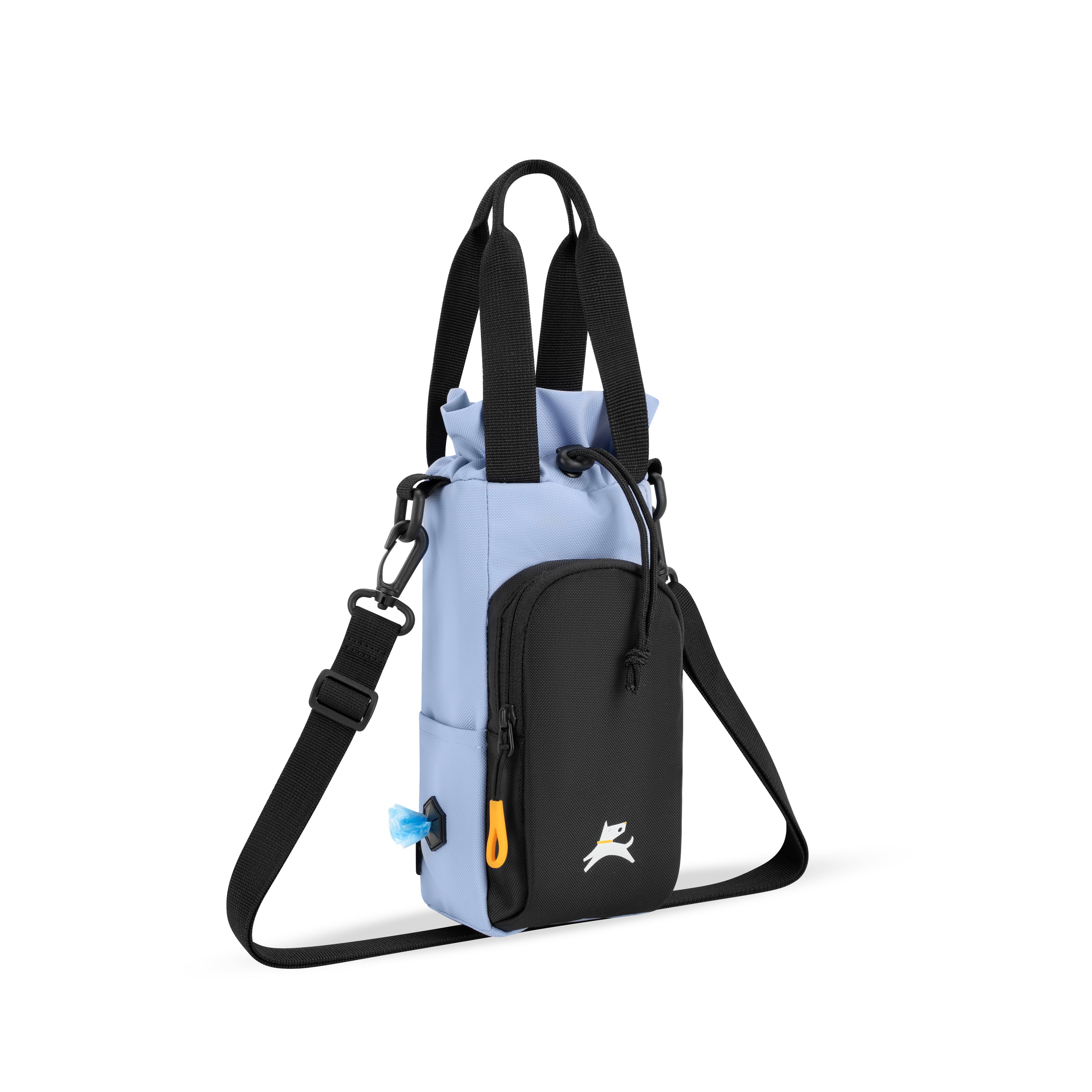 OllyDog OllyCaddy dog walking carryall in blue heron, showcasing the side-mounted waste bag dispenser, front treat pocket, and adjustable crossbody strap. #color_blue heron