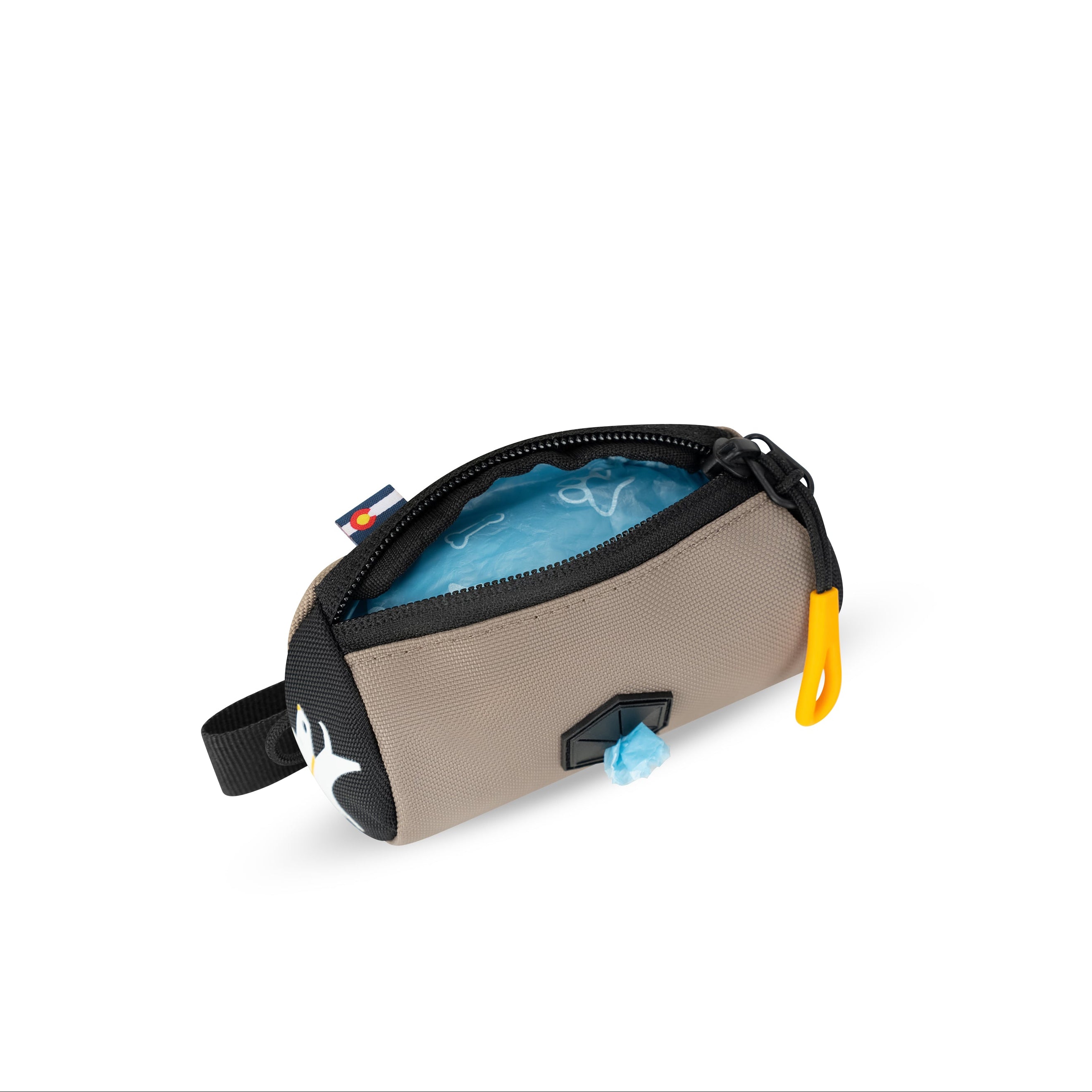 Top-down interior view of the OllyDog Scoop Pick Up Bag in dune color, showing the open zippered compartment and standard waste bags inside. #color_dune