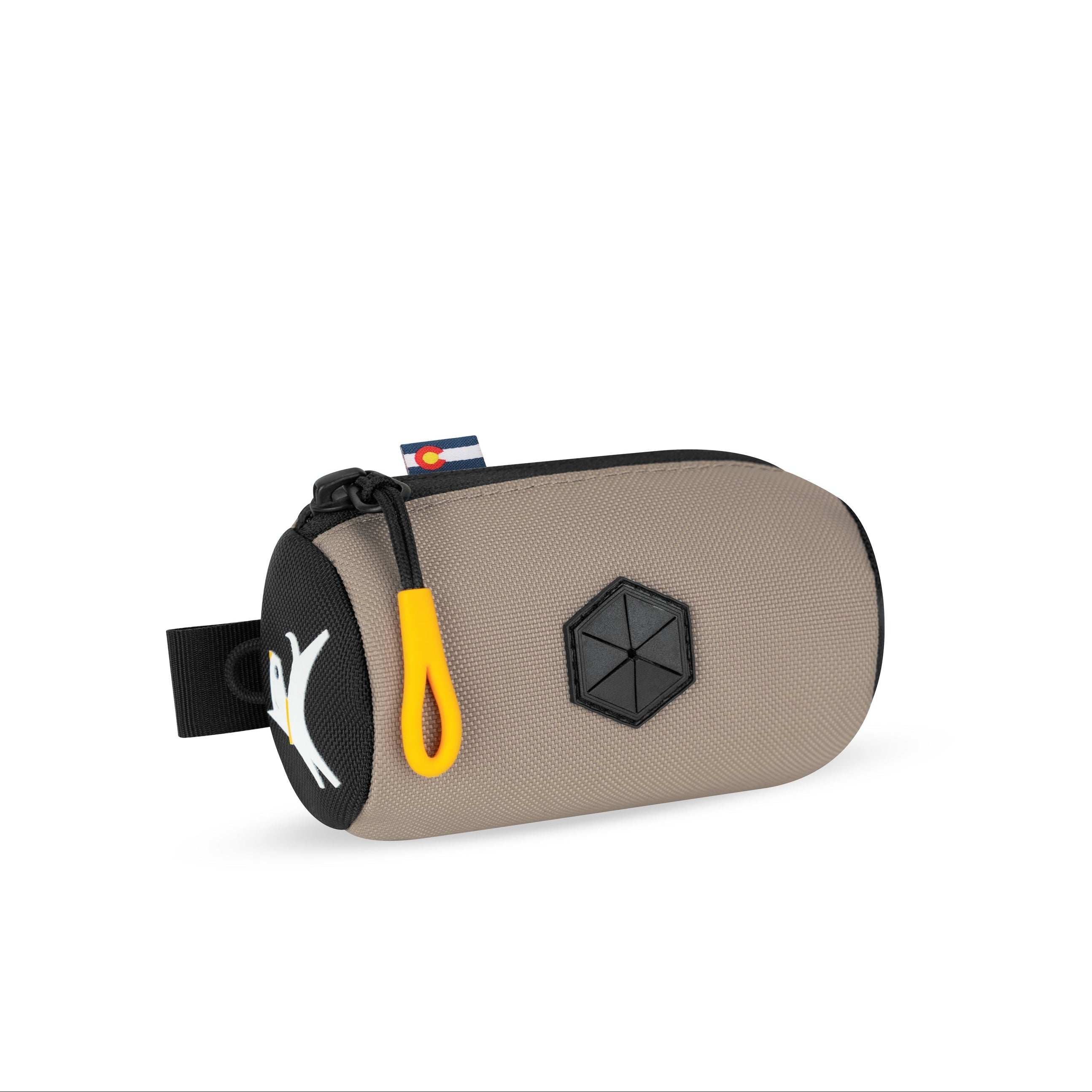 Side-angle view of the OllyDog Scoop Pick Up Bag in dune color, showcasing the 100% recycled polyester material, zippered closure, and integrated waste bag dispenser. #color_dune