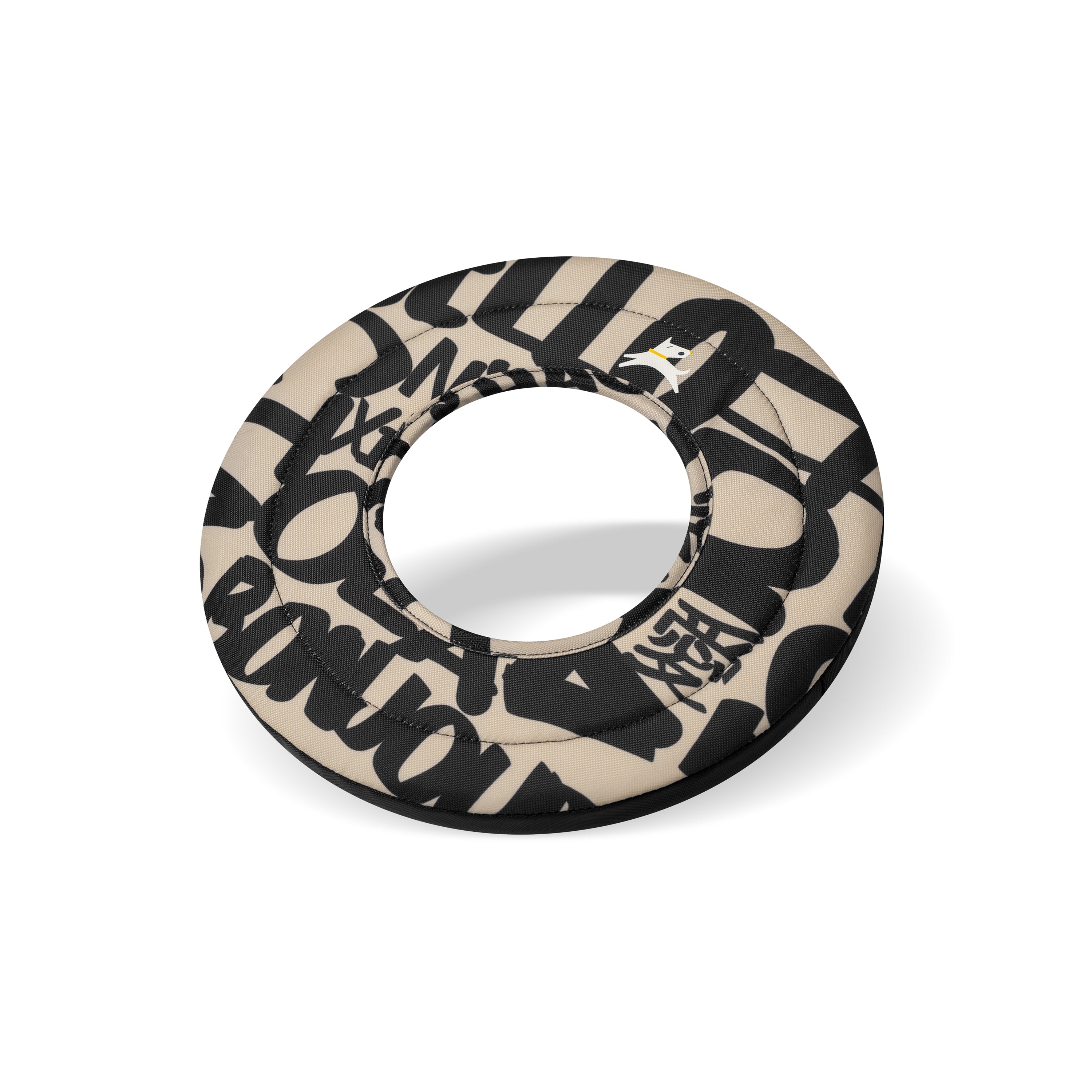 Side-angle view of the OllyDog Super Flyer dog flying disc in ciao typographic print color, highlighting its lightweight, easy-to-grab, and water-compatible recycled polyester design. #color_ciao