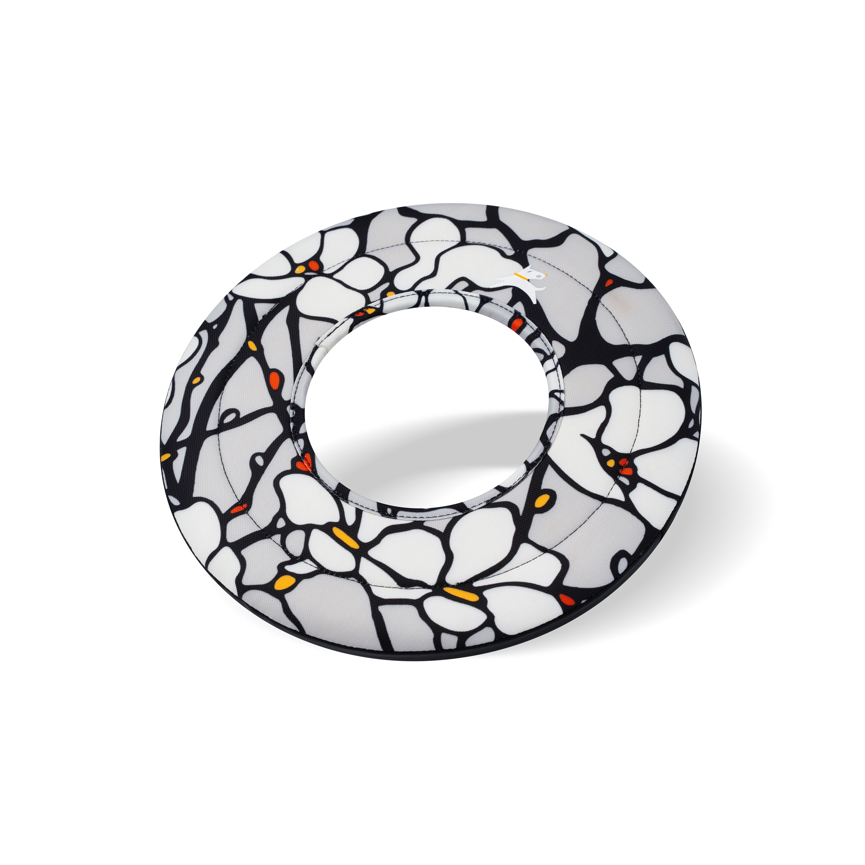 Side-angle view of the OllyDog Super Flyer dog flying disc in magnolia color, highlighting its lightweight, easy-to-grab, and water-compatible recycled polyester design.#color_magnolia