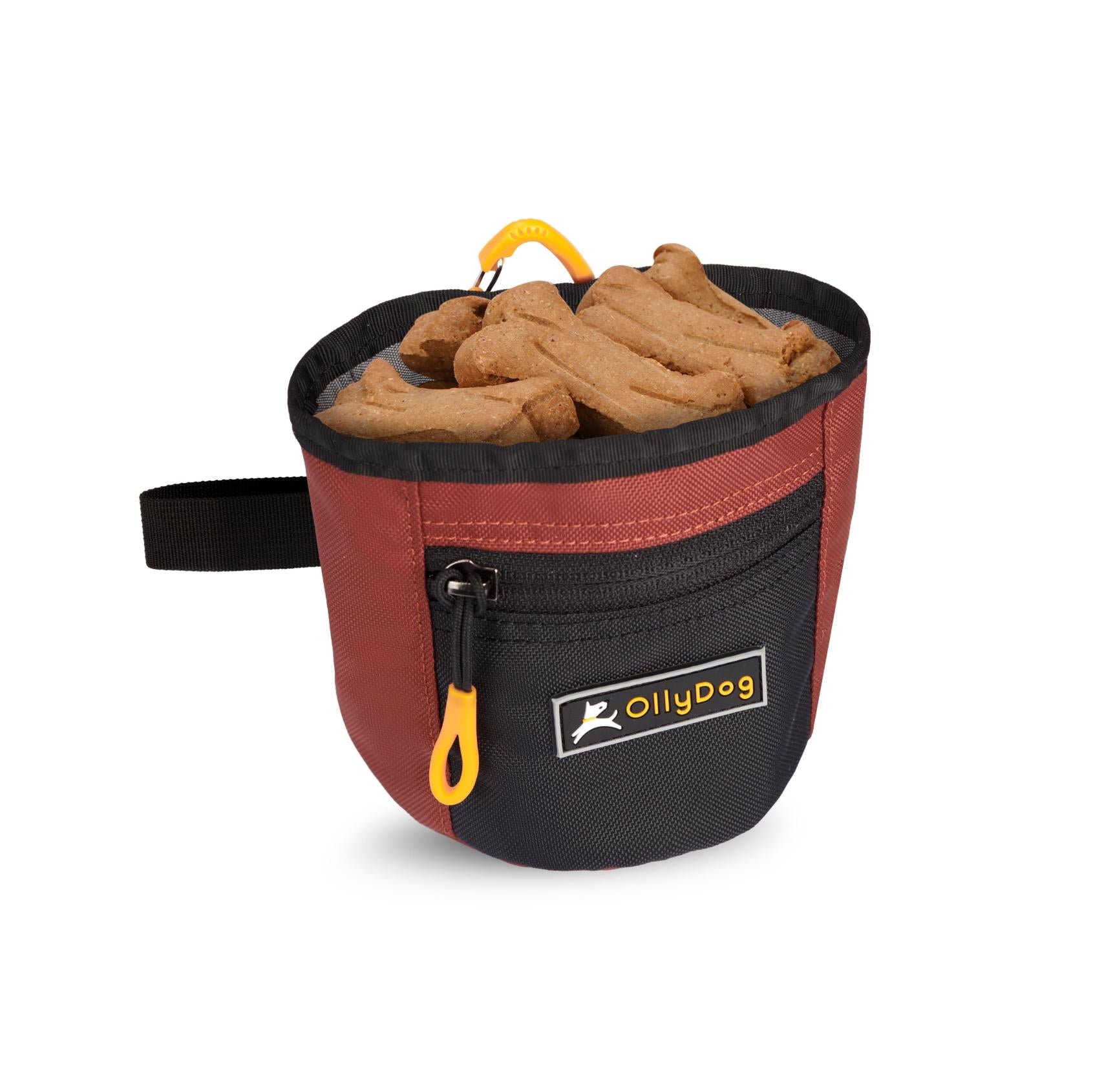 An example image of the Goodie Treat Bag (Cider color) full of dog treats. This dog training tool allows quick access to dog treats so you can reward your dog's good behavior. #color_cider