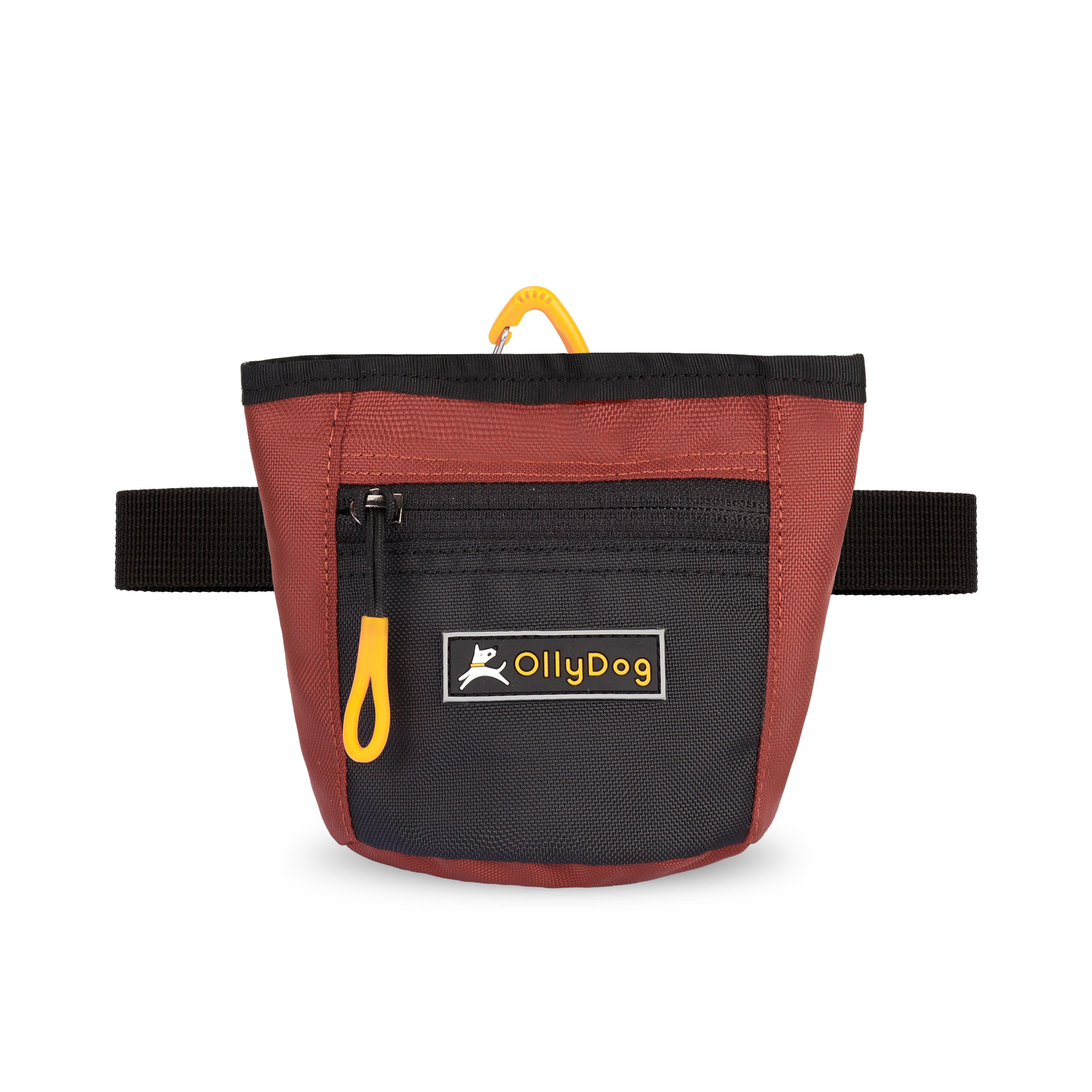 Flat front view of OllyDog’s Goodie Treat Bag in Cider. The dog treat pouch includes a magnetic closure on the main compartment, a front zipper pocket, and an adjustable waist strap for hands-free dog training. #color_cider