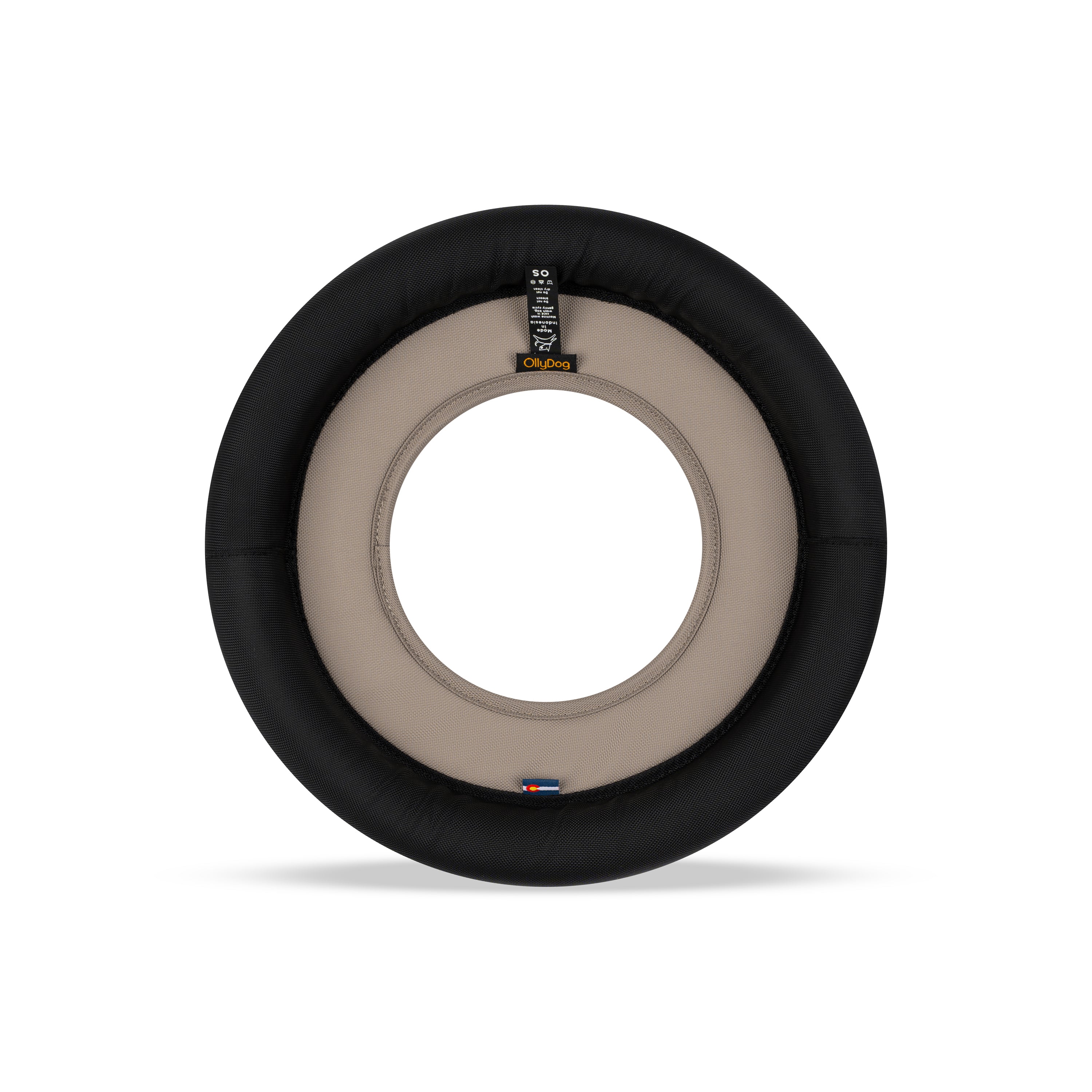 Back view of the OllyDog Super Flyer dog flying disc in dune color, highlighting the durable recycled polyester construction and branding details. #color_dune