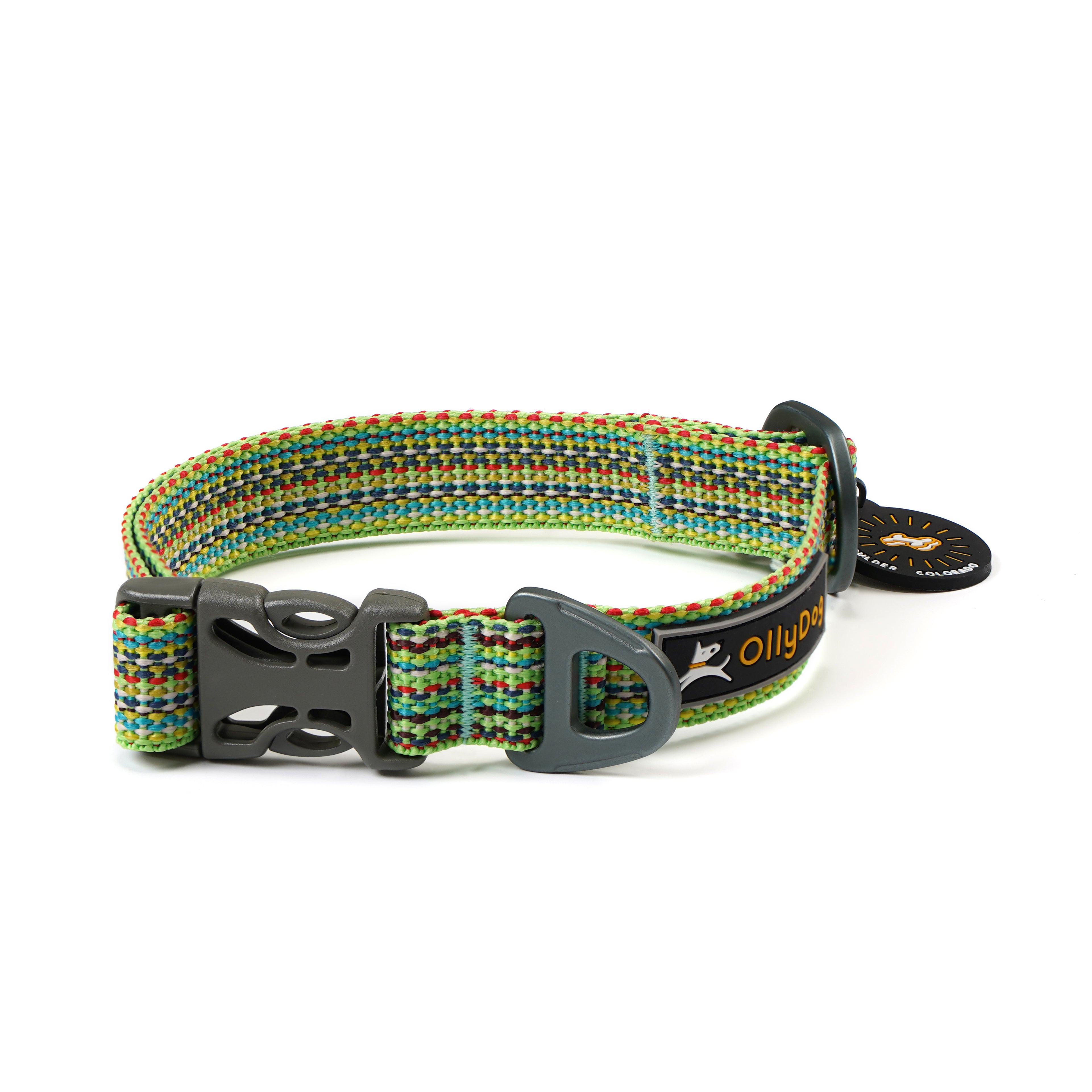Angled view of the OllyDog Rescue Dog Collar in Prism Green, showcasing the colorful recycled webbing, black plastic side-release buckle, durable aluminum D-ring, and branded silicone tag silencer #color_prism green