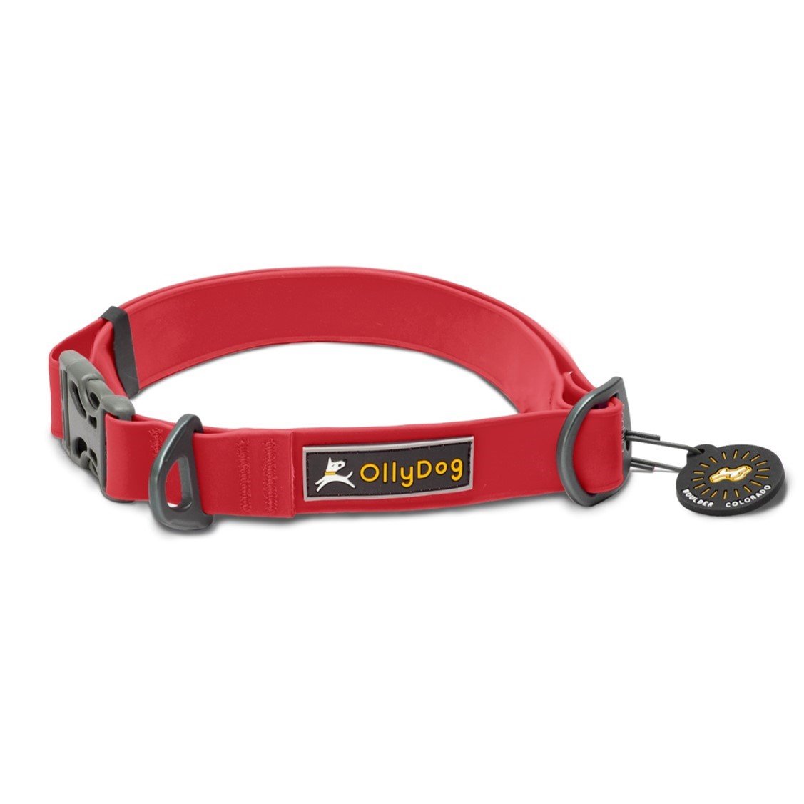 Front view of the OllyDog Tilden Waterproof Collar in red color, featuring waterproof AquaGuard coating, an easy-releasing plastic side-buckle, a secure aluminum D-ring, the OllyDog brand label, and an attached Boulder Colorado tag. #color_red